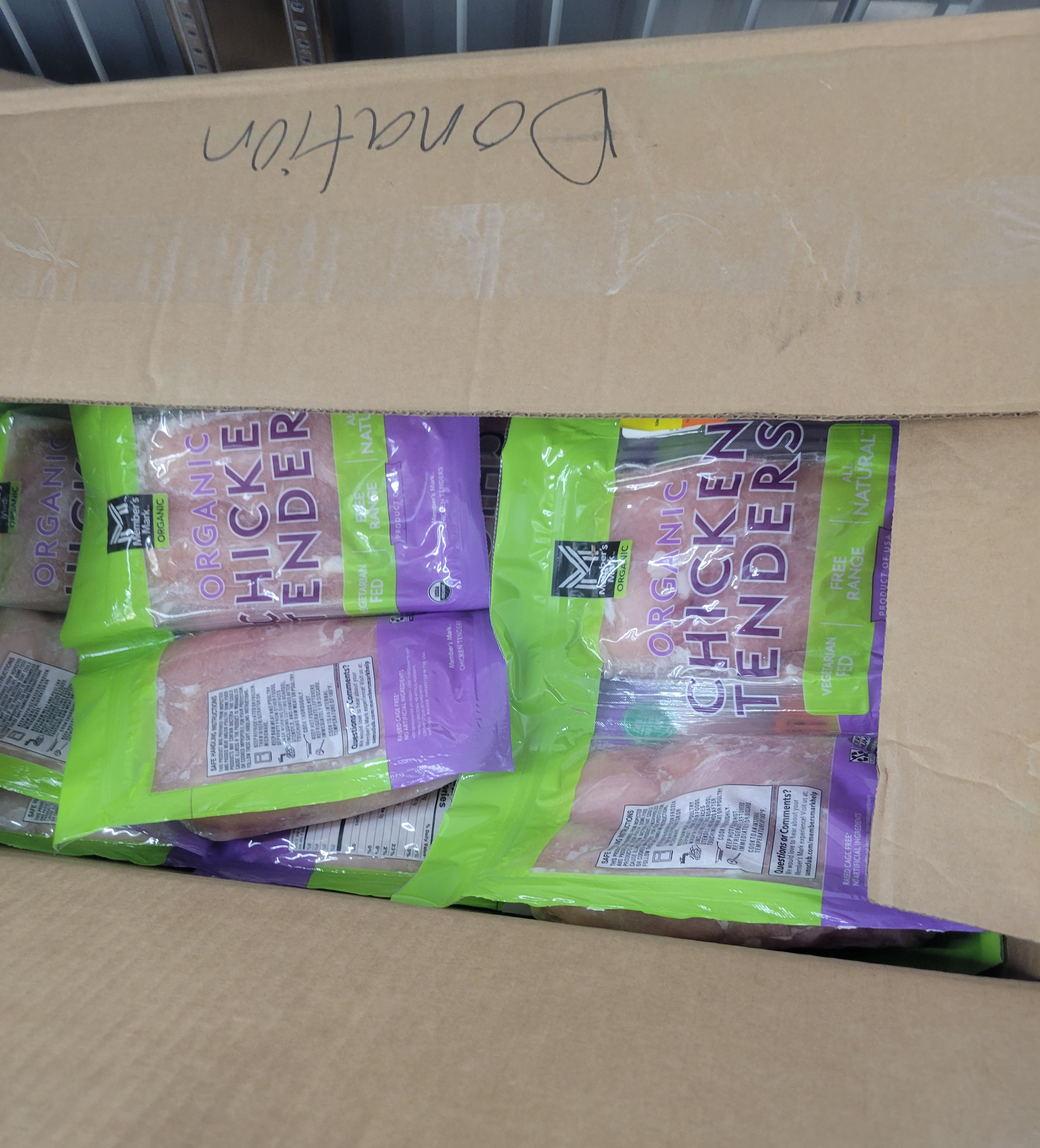 Bags of chicken tenders in a cardboard box.